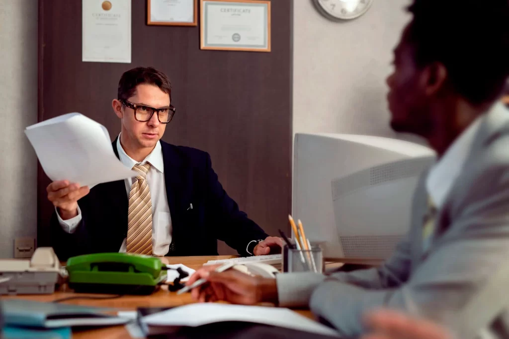 vintage-style-people-working-office-with-computers-scaled